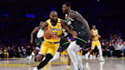 Los Angeles Lakers forward LeBron James drives against Minnesota Timberwolves star Julius Randle during the 2025 NBA Playoffs