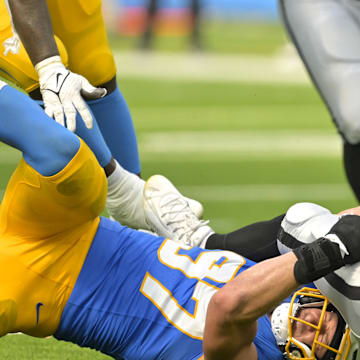 Sep 8, 2024; Inglewood, California, USA; Las Vegas Raiders quarterback Gardner Minshew (15) is sacked by Los Angeles Chargers linebacker Joey Bosa (97) in the second half at SoFi Stadium. Mandatory Credit: Jayne Kamin-Oncea-Imagn Images