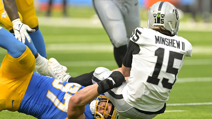 Sep 8, 2024; Inglewood, California, USA; Las Vegas Raiders quarterback Gardner Minshew (15) is sacked by Los Angeles Chargers linebacker Joey Bosa (97) in the second half at SoFi Stadium. Mandatory Credit: Jayne Kamin-Oncea-Imagn Images