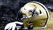 Aug 13, 2023; New Orleans, Louisiana, USA;  Detailed view of the New Orleans Saints helmet and glove during pregame against the Kansas City Chiefs at the Caesars Superdome. Mandatory Credit: Stephen Lew-Imagn Images