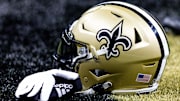 Aug 13, 2023; New Orleans, Louisiana, USA;  Detailed view of the New Orleans Saints helmet and glove during pregame against the Kansas City Chiefs at the Caesars Superdome. Mandatory Credit: Stephen Lew-Imagn Images