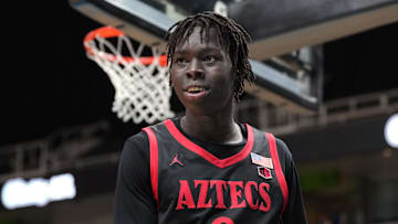 Dec 21, 2024; San Jose, California, USA; San Diego State Aztecs forward Magoon Gwath (0) during the second half against the California Golden Bears at SAP Center. Mandatory Credit: Darren Yamashita-Imagn Images