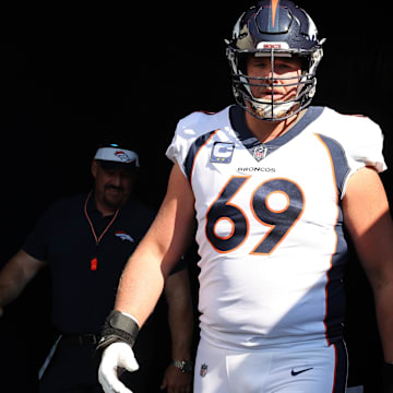 Oct 1, 2023; Chicago, Illinois, USA; Denver Broncos offensive tackle Mike McGlinchey (69) takes the field before the game against the Chicago Bears at Soldier Field. Mandatory Credit: Mike Dinovo-Imagn Images