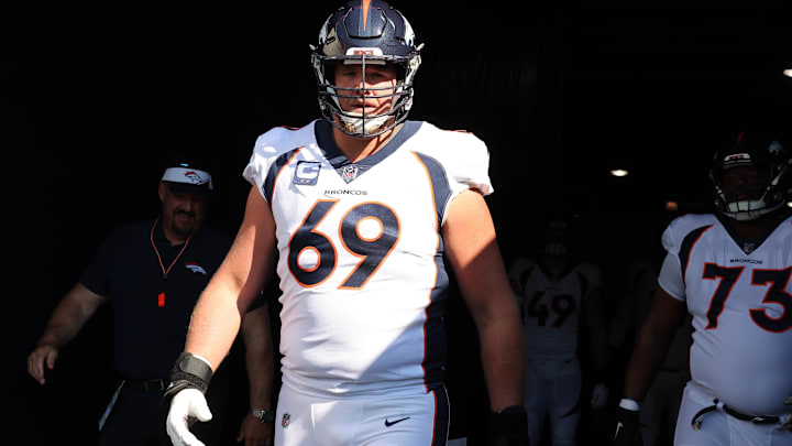 Oct 1, 2023; Chicago, Illinois, USA; Denver Broncos offensive tackle Mike McGlinchey (69) takes the field before the game against the Chicago Bears at Soldier Field. Mandatory Credit: Mike Dinovo-Imagn Images