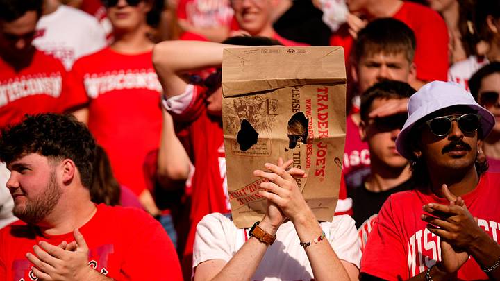 A Wisconsin Badger fan wears a bag on his head in the first half at Camp Randall Stadium on Saturday, Oct. 18, 2025 in Madison, Wisconsin.