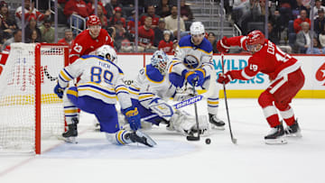 Nov 2, 2024; Detroit, Michigan, USA; Detroit Red Wings center Andrew Copp (18) shoots the puck against Buffalo Sabres goaltender Ukko-Pekka Luukkonen (1) during the second period  at Little Caesars Arena. Mandatory Credit: Brian Bradshaw Sevald-Imagn Images