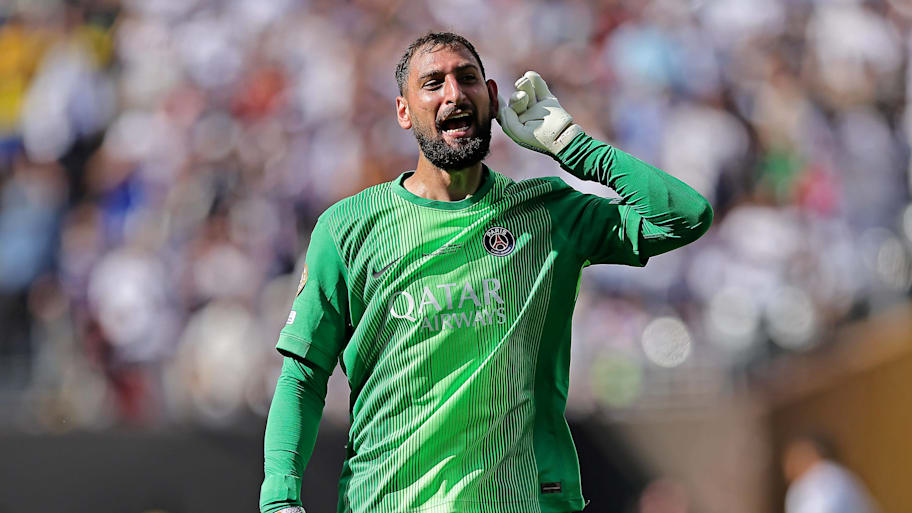 Gianluigi Donnarumma pointing to his ear.