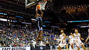 Mar 27, 2025; Newark, NJ, USA; Brigham Young Cougars forward Kanon Catchings (6) dunks the ball agains Alabama Crimson Tide guard Chris Youngblood (8) during the first half during an East Regional semifinal of the 2025 NCAA tournament at Prudential Center. Mandatory Credit: Vincent Carchietta-Imagn Images