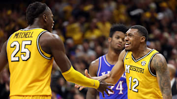 Missouri Tigers Mark Mitchell (25), and Tony Perkins (12) celebrate during a hard fought win versus the Kansas Jayhawks.