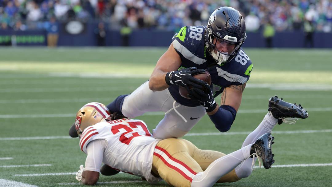 Oct 11, 2026; Seattle, Washington, USA; Seattle Seahawks tight end AJ Barner (88) dives with the ball against San Francisco 49ers safety Ji'Ayir Brown (27) during the second half at Lumen Field. Oct 11, 2026; Seattle, Washington, USA; Seattle Seahawks tight end AJ Barner (88) dives with the ball against San Francisco 49ers safety Ji'Ayir Brown (27) during the second half at Lumen Field.