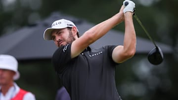 Patrick Cantlay plays his shot from the 18th tee during the third round of the TOUR Championship 