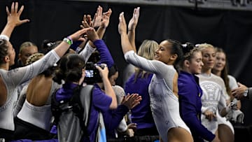 Apr 20, 2024; Fort Worth, TX, USA; LSU Tigers gymnast Haleigh Bryant celebrates with her team after she performs on vault during the 2024 Womens National Gymnastics Championship at Dickies Arena. Mandatory Credit: Jerome Miron-Imagn Images