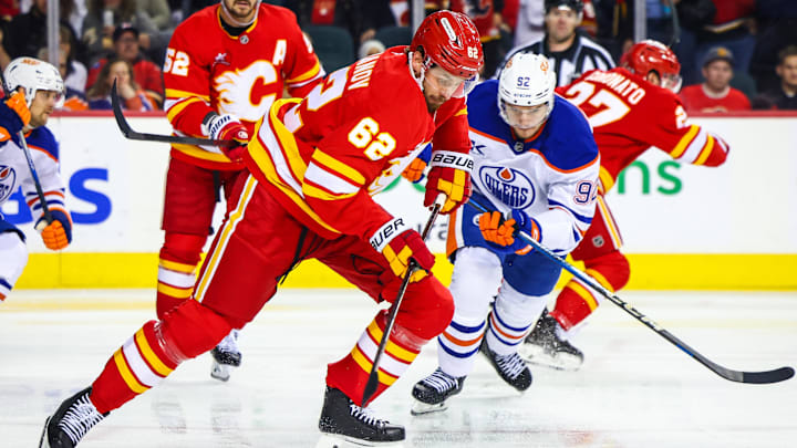 Nov 3, 2024; Calgary, Alberta, CAN; Calgary Flames defenseman Daniil Miromanov (62) skates with the puck against the Edmonton Oilers during the third period at Scotiabank Saddledome. Mandatory Credit: Sergei Belski-Imagn Images
