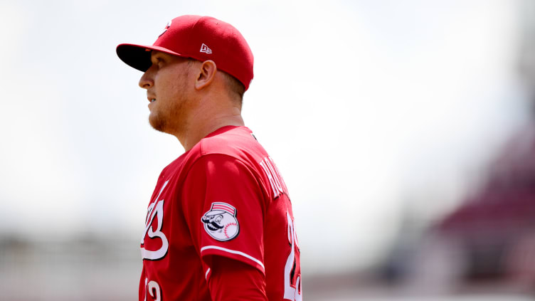 Cincinnati Reds pitcher Jeff Hoffman looks on.