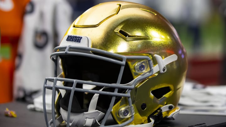 Jan 1, 2022; Glendale, Arizona, USA; Detailed view of a gold Notre Dame Fighting Irish helmet during the 2022 Fiesta Bowl at State Farm Stadium