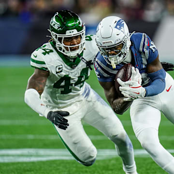 Nov 13, 2025; Foxborough, Massachusetts, USA; New England Patriots wide receiver Stefon Diggs (8) runs the ball against New York Jets linebacker Jamien Sherwood (44) in the fourth quarter at Gillette Stadium. Mandatory Credit: David Butler II-Imagn Images