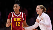 Feb 13, 2025; Los Angeles, California, USA; USC Trojans guard JuJu Watkins (12) talks to USC Trojans head coach Lindsay Gottliebduring an NCAA basketball game at Galen Center. Mandatory Credit: Robert Hanashiro-Imagn Images