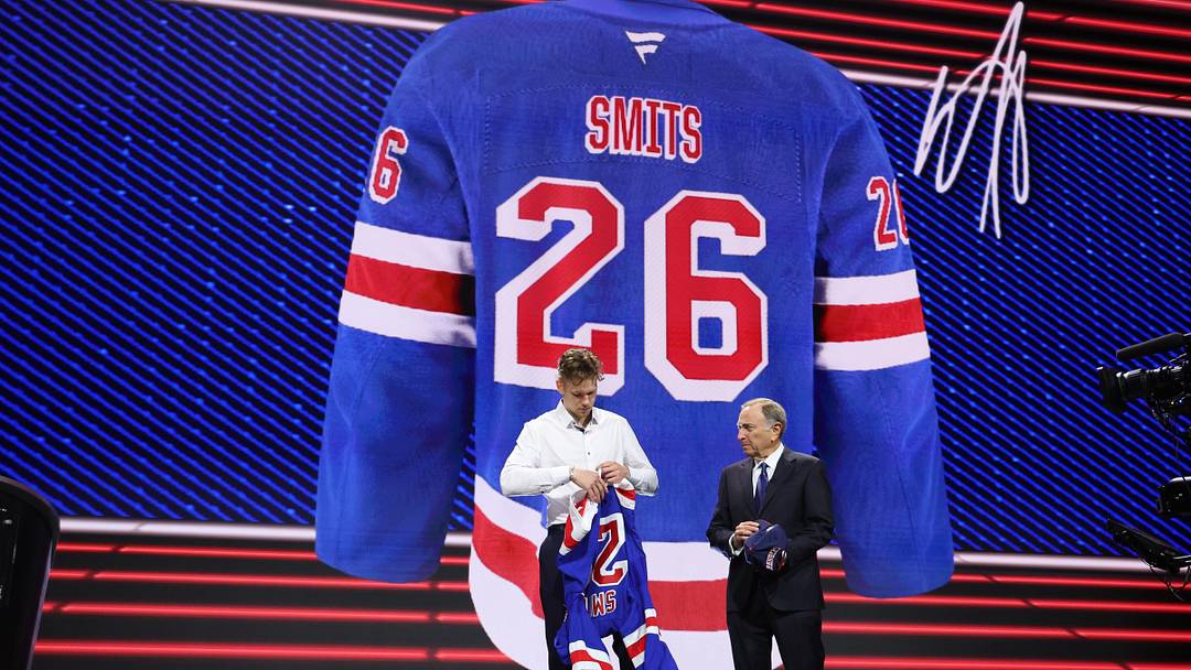 Jun 26, 2026; Buffalo, New York, USA; Alberts Smits reacts beside NHL commissioner Gary Bettman after being selected with the fifth pick in the first round of the 2026 NHL Draft by the New York Rangers at KeyBank Center. Mandatory Credit: Timothy T. Ludwig-Imagn Images Jun 26, 2026; Buffalo, New York, USA; Alberts Smits reacts beside NHL commissioner Gary Bettman after being selected with the fifth pick in the first round of the 2026 NHL Draft by the New York Rangers at KeyBank Center. Mandatory Credit: Timothy T. Ludwig-Imagn Images