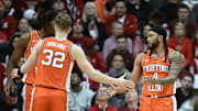 Jan 14, 2025; Bloomington, Indiana, USA; Illinois Fighting Illini guard Kasparas Jakucionis (32) high-fives Illinois Fighting Illini guard Kylan Boswell (4) during the first half against the Indiana Hoosiers at Simon Skjodt Assembly Hall. Mandatory Credit: Robert Goddin-Imagn Images