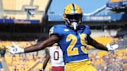 Oct 4, 2025; Pittsburgh, Pennsylvania, USA;  Pittsburgh Panthers running back Ja'Kyrian Turner (25) reacts in the end zone after scoring a touchdown against the Boston College Eagles during the second quarter at Acrisure Stadium. Mandatory Credit: Charles LeClaire-Imagn Images