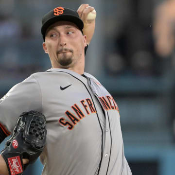 Jul 22, 2024; Los Angeles, California, USA;  San Francisco Giants starting pitcher Blake Snell (7) delivers to the plate in the second inning against the Los Angeles Dodgers at Dodger Stadium.