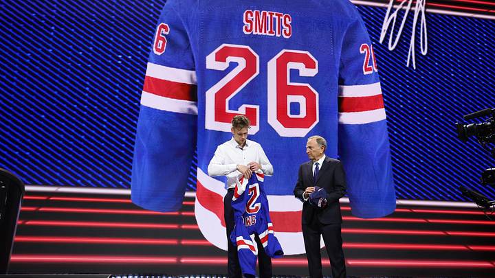 Jun 26, 2026; Buffalo, New York, USA; Alberts Smits reacts beside NHL commissioner Gary Bettman after being selected with the fifth pick in the first round of the 2026 NHL Draft by the New York Rangers at KeyBank Center. Mandatory Credit: Timothy T. Ludwig-Imagn Images