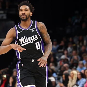 Dec 31, 2023; Memphis, Tennessee, USA; Sacramento Kings guard Malik Monk (0) reacts after a three point basket during the second half against the Memphis Grizzlies at FedExForum. Mandatory Credit: Petre Thomas-Imagn Images