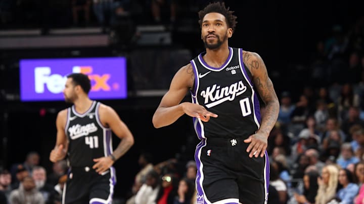 Dec 31, 2023; Memphis, Tennessee, USA; Sacramento Kings guard Malik Monk (0) reacts after a three point basket during the second half against the Memphis Grizzlies at FedExForum. Mandatory Credit: Petre Thomas-Imagn Images