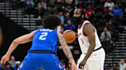 Oct 14, 2024; Inglewood, California, USA; LA Clippers guard James Harden (1) looks to pass against Dallas Mavericks center Dereck Lively II (2) during the first half at Intuit Dome. Mandatory Credit: Jonathan Hui-Imagn Images