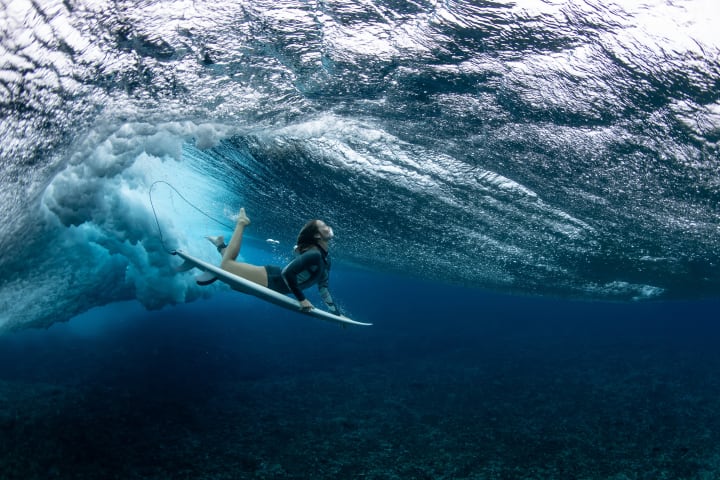 TEAHUPO'O, FRENCH POLYNESIA - AUGUST 19: Australian surfer Olivia Ottaway dives under a wave on August 19, 2023 in Teahupo'o, French Polynesia. Teahupo'o has been hosting the WSL Tahiti Pro event for over two decades and will next year host the surfing event for the Paris 2024 Olympic Games. 
