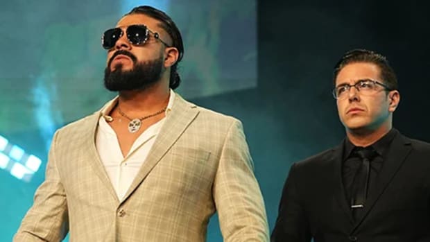 Andrade appears on stage with Jose The Assistant on AEW TV.