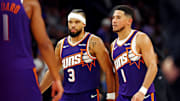 Oct 22, 2025; Phoenix, Arizona, USA; Phoenix Suns guard Devin Booker (1) and forward Dillon Brooks (3) during the second half against the Sacramento Kings at the Mortgage Matchup Center. Mandatory Credit: Mark J. Rebilas-Imagn Images