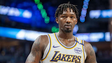 Apr 27, 2025; Minneapolis, Minnesota, USA; Los Angeles Lakers forward Dorian Finney-Smith (17) heads to the sidelines to inbound the ball against the Minnesota Timberwolves in the third quarter during game four of first round for the 2025 NBA Playoffs at Target Center. Mandatory Credit: Matt Blewett-Imagn Images