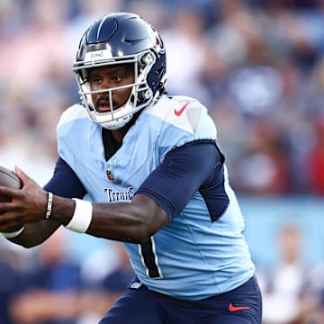 Aug 17, 2024; Nashville, Tennessee, USA; Tennessee Titans quarterback Malik Willis (7) catches a snap in the second quarter of the game agains the Seattle Seahawks at Nissan Stadium. Mandatory Credit: Casey Gower-Imagn Images