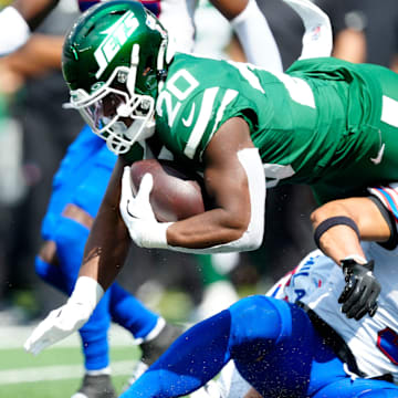 New York Jets running back Breece Hall (20) dives for another few yards, Sunday, September 14, 2025, in East Rutherford.