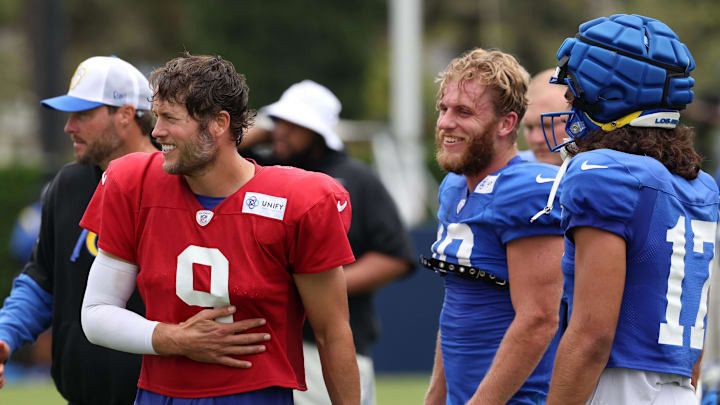 Aug 1, 2024; Los Angeles, CA, USA;  Los Angeles Rams quarterback Matthew Stafford (9) talks with wide receiver Cooper Kupp (10) and wide receiver Puka Nacua (17) during training camp at Loyola Marymount University. Mandatory Credit: Kiyoshi Mio-Imagn Images