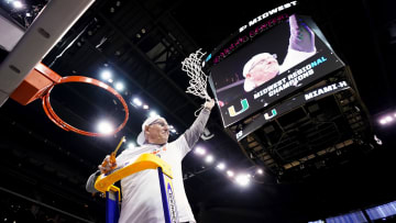 Mar 26, 2023; Kansas City, MO, USA; Miami (FL) head coach Jim Larranaga cuts down the net after defeating Texas in the Elite 8.