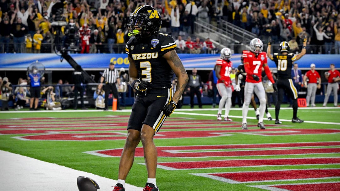 Dec 29, 2023; Arlington, TX, USA; Missouri Tigers wide receiver Luther Burden III (3) spikes the ball after he catches a pass for a touchdown against the Ohio State Buckeyes during the fourth quarter at AT&T Stadium. Mandatory Credit: Jerome Miron-USA TODAY Sports