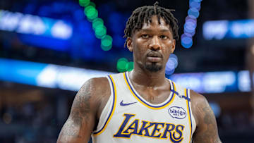 Apr 27, 2025; Minneapolis, Minnesota, USA; Los Angeles Lakers forward Dorian Finney-Smith (17) heads to the sidelines to inbound the ball against the Minnesota Timberwolves in the third quarter during game four of first round for the 2025 NBA Playoffs at Target Center. Mandatory Credit: Matt Blewett-Imagn Images