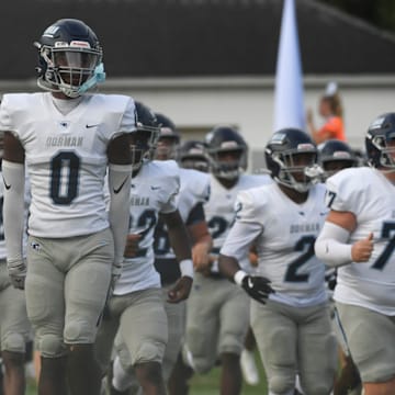 The Dorman Cavaliers take to the field Friday, Aug. 22, 2025 during the SCHSL football game against the Greenville Red Raiders at Greenville High School in Greenville, South Carolina.