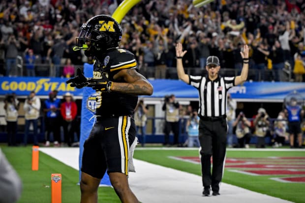 Missouri Tigers wide receiver Luther Burden III celebrates after he catches a pass for a touchdown against Ohio State. 