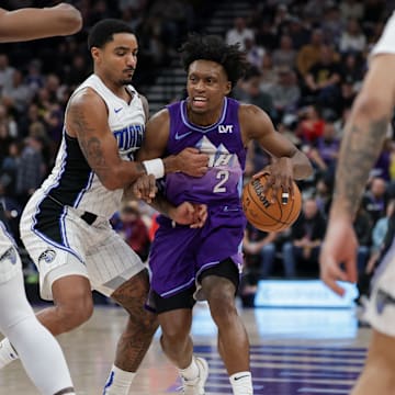 Feb 1, 2025; Salt Lake City, Utah, USA;  Utah Jazz guard Collin Sexton (2) is fouled by Orlando Magic guard Gary Harris (14) during the second half at Delta Center. Mandatory Credit: Chris Nicoll-Imagn Images