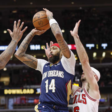 Dec 2, 2023; Chicago, Illinois, USA; New Orleans Pelicans forward Brandon Ingram (14) looks to pass the ball against Chicago Bulls forward DeMar DeRozan (11) during the first half at United Center.