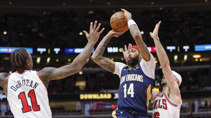 Dec 2, 2023; Chicago, Illinois, USA; New Orleans Pelicans forward Brandon Ingram (14) looks to pass the ball against Chicago Bulls forward DeMar DeRozan (11) during the first half at United Center.