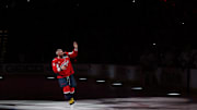 Apr 10, 2025; Washington, District of Columbia, USA; Washington Capitals left wing Alex Ovechkin (8) acknowledges fans while being introduced during a ceremony honoring his becoming the NHL all-time goals leader prior to the Capitals' game against the Carolina Hurricanes at Capital One Arena. Mandatory Credit: Geoff Burke-Imagn Images