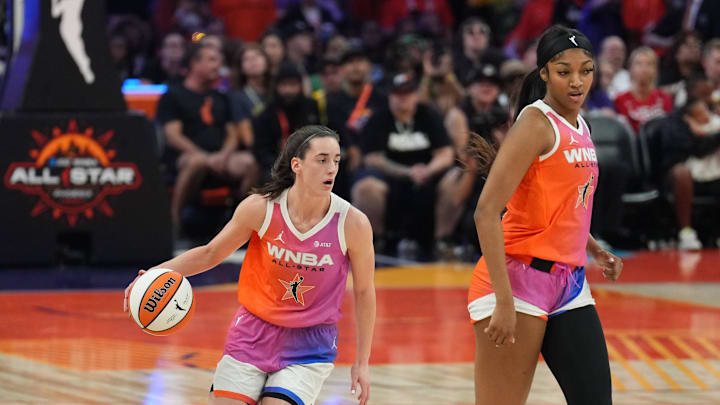 Jul 20, 2024; Phoenix, AZ, USA; Team WNBA guard Caitlin Clark (22) dribbles alongside Team WNBA forward Angel Reese (5) against USA Women's National Team during the WNBA All Star Game at Footprint Center. Jul 20, 2024; Phoenix, AZ, USA; Team WNBA guard Caitlin Clark (22) dribbles alongside Team WNBA forward Angel Reese (5) against USA Women's National Team during the WNBA All Star Game at Footprint Center.