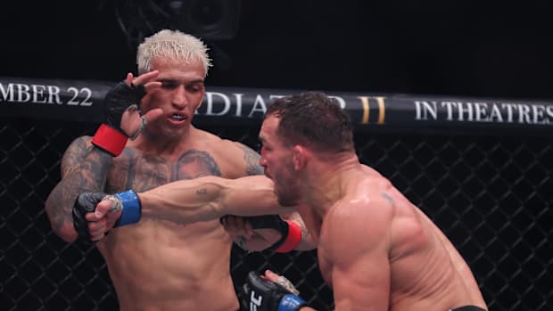 Charles Oliveira fighting Michael Chandle