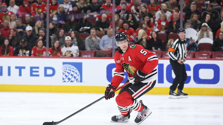 Feb 2, 2026; Chicago, Illinois, USA; Chicago Blackhawks defenseman Connor Murphy (5) skates with the puck during the second period against the San Jose Sharks at United Center. Mandatory Credit: Talia Sprague-Imagn Images