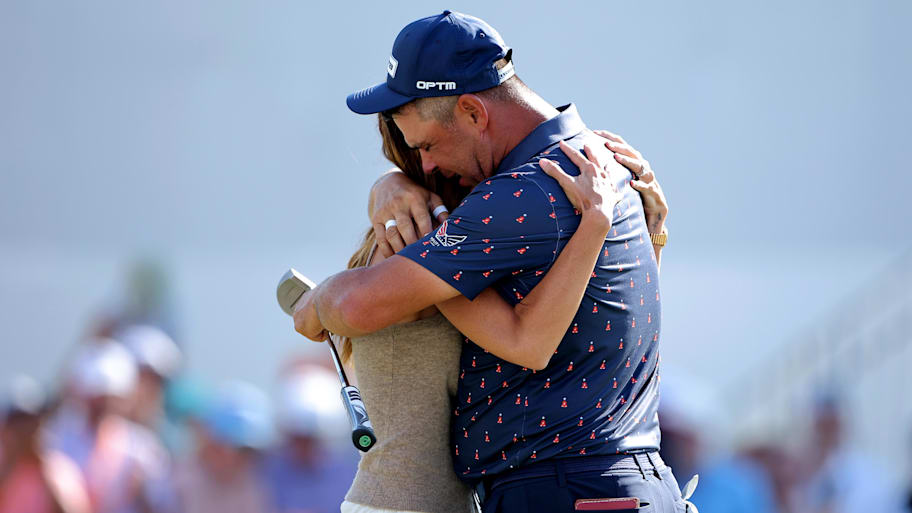 Gary Woodland is greeted by his wife, Gabby Woodland, after putting to win the Texas Children's Houston Open 