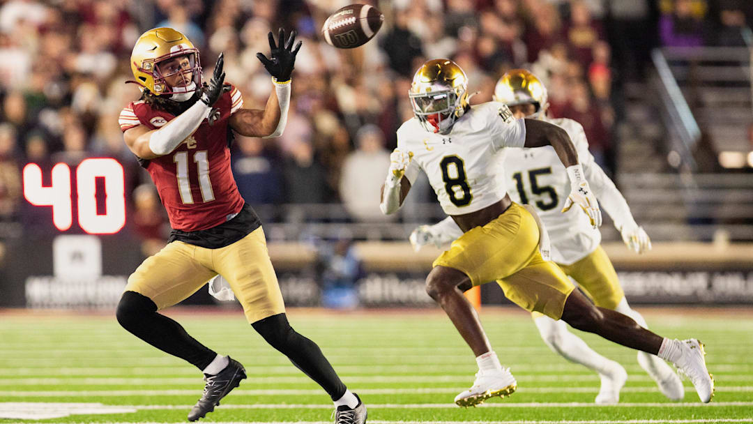 Nov 1, 2025; Chestnut Hill, Massachusetts, USA; Boston College Eagles wide receiver Lewis Bond (11) catches a pass against Notre Dame Fighting Irish safety Adon Shuler (8) in the fourth quarter at Alumni Stadium. Mandatory Credit: Edward Finan-Imagn Images